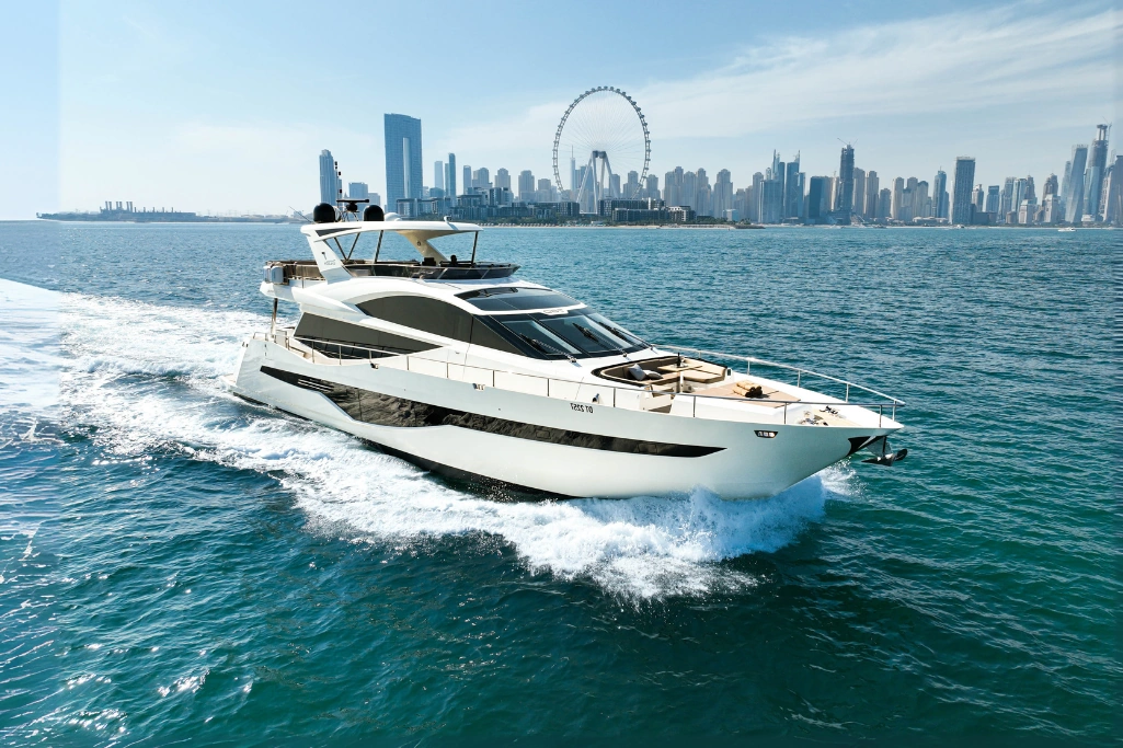 Uniq 78 yacht rental in Dubai Marina with luxury skyline backdrop