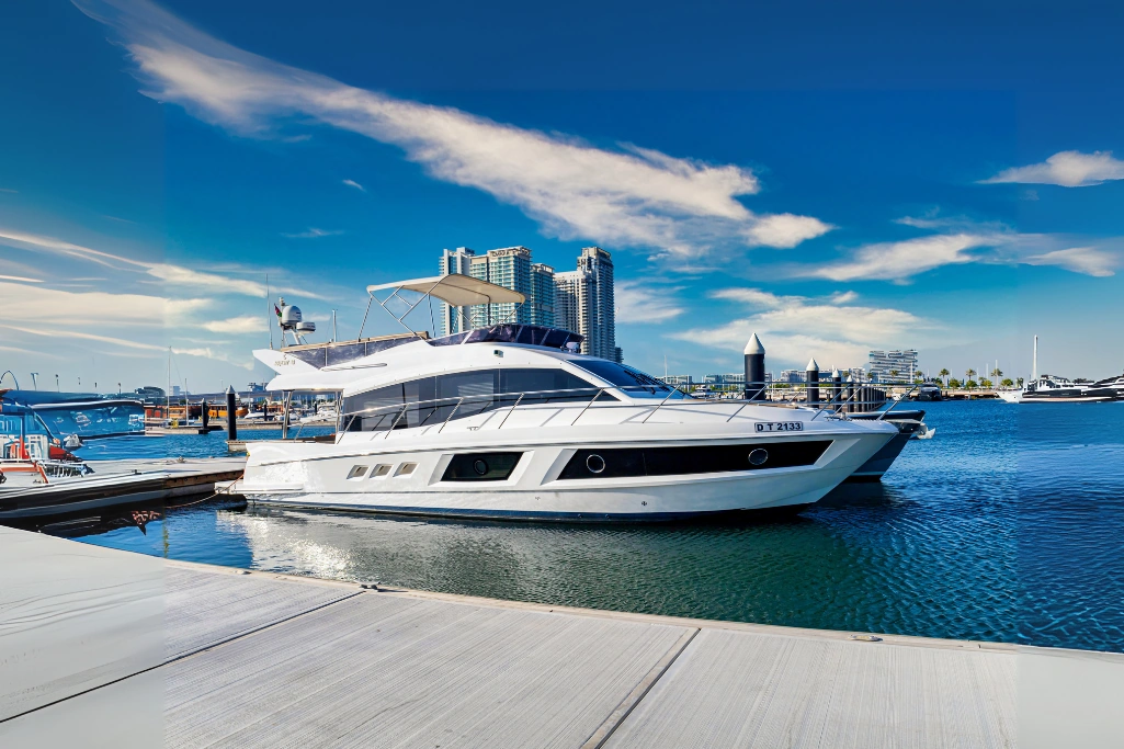 Uniq 48ft yacht rental in Dubai Marina with luxury skyline backdrop