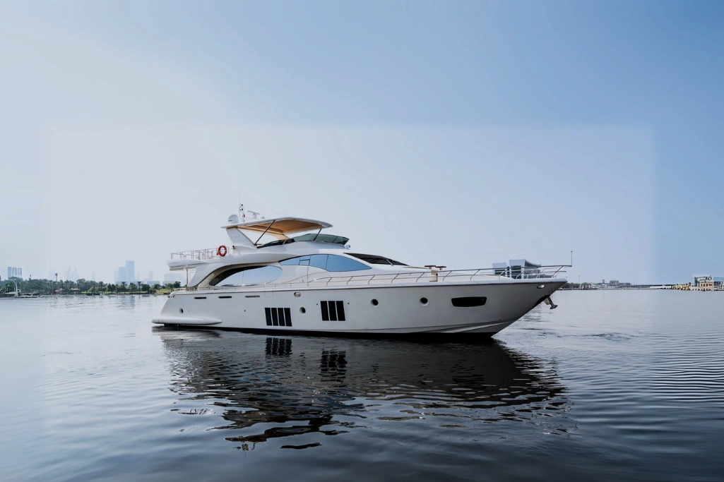 Uniq 88 yacht rental in Dubai Marina with luxury skyline backdrop